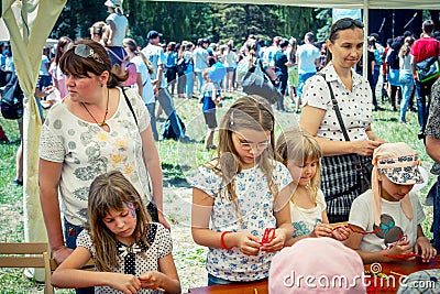 Small girls participating at art and craft outdoor workshop Editorial Stock Photo